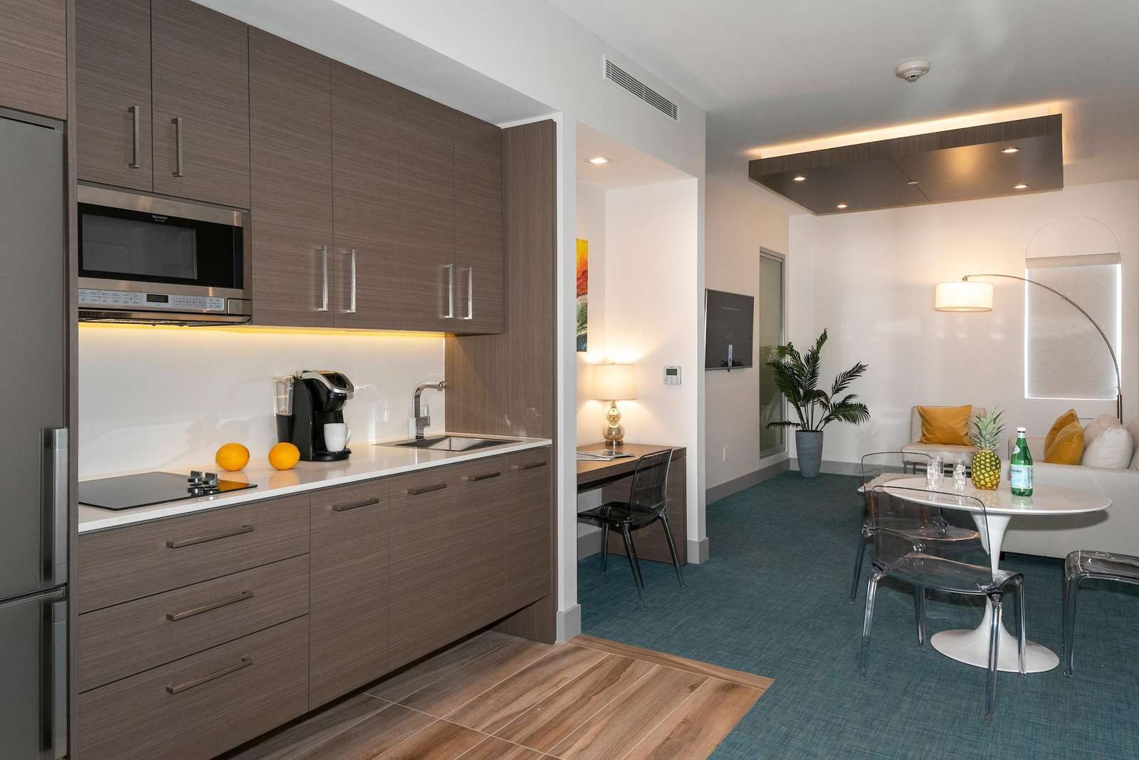 Kitchenette and dining table in a St. John suite at Marketplace Suites